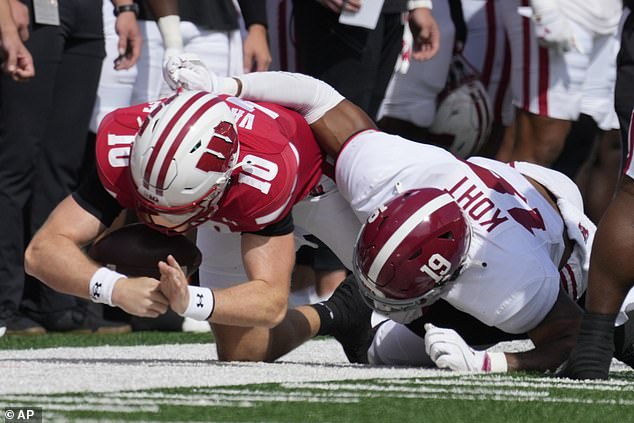 Tyler Van Dyke is carted off after injuring his knee in Wisconsin’s opening drive against Alabama in a crucial home game