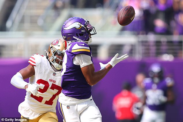 Minnesota Vikings Receiver Justin Jefferson Shines with a 98-Yard Touchdown Pass as Referee Tyree Walton Impressively Keeps Pace During the Game Against the San Francisco 49ers