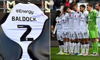 MK Dons dedicate their home game against Port Vale to former player George Baldock as fans, players, and staff come together to remember his life and career